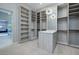 Large walk-in closet with built-in shelving and mirror at 37 Reflection Shores Ln, Henderson, NV 89011