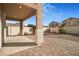 Spacious backyard with gravel and a paved patio area at 3817 Bella Legato Ave, North Las Vegas, NV 89081