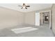 Spacious bedroom with ceiling fan and access to hallway at 3817 Bella Legato Ave, North Las Vegas, NV 89081