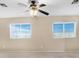 Bright bedroom with ceiling fan and two windows at 3817 Bella Legato Ave, North Las Vegas, NV 89081