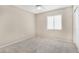 Well-lit bedroom with ceiling fan and carpet flooring at 3817 Bella Legato Ave, North Las Vegas, NV 89081