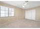 Spacious bedroom with ceiling fan and sliding door to balcony at 3817 Bella Legato Ave, North Las Vegas, NV 89081