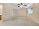 Spacious bedroom with ceiling fan and access to bathroom at 3817 Bella Legato Ave, North Las Vegas, NV 89081