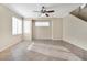 Bright living room with tile floors, ceiling fan and stairs at 3817 Bella Legato Ave, North Las Vegas, NV 89081