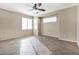 Spacious living room with tile floors and ceiling fan at 3817 Bella Legato Ave, North Las Vegas, NV 89081