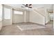 Living room with tile floors, ceiling fan and stairs at 3817 Bella Legato Ave, North Las Vegas, NV 89081