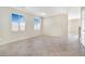 Spacious living room with tile flooring and large windows at 3817 Bella Legato Ave, North Las Vegas, NV 89081