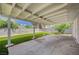 Covered patio and grassy area in the backyard at 3834 S Sandhill Rd, Las Vegas, NV 89121