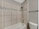 Bathroom with shower/tub combo and tile surround at 3834 S Sandhill Rd, Las Vegas, NV 89121