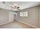 Bright bedroom with mirrored closet and ceiling fan at 3834 S Sandhill Rd, Las Vegas, NV 89121