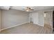 Well-lit bedroom featuring a mirrored closet and wood-look floors at 3834 S Sandhill Rd, Las Vegas, NV 89121