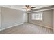 Bright bedroom with wood-look floors and ceiling fan at 3834 S Sandhill Rd, Las Vegas, NV 89121