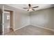 Well-lit bedroom with wood-look floors and access to hallway at 3834 S Sandhill Rd, Las Vegas, NV 89121