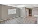 Bright dining room with wood-look floors and access to kitchen at 3834 S Sandhill Rd, Las Vegas, NV 89121