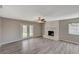 Bright living room with fireplace and sliding glass doors at 3834 S Sandhill Rd, Las Vegas, NV 89121