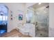 Spa-like bathroom with soaking tub and a walk-in shower at 5378 Pendini Point Ct, Las Vegas, NV 89141