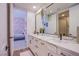 Modern bathroom with dual vanity and marble countertops at 5378 Pendini Point Ct, Las Vegas, NV 89141