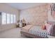 Charming bedroom with floral wallpaper and window seating at 5378 Pendini Point Ct, Las Vegas, NV 89141