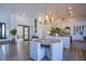 Elegant dining area with a round table and modern seating near the kitchen at 5378 Pendini Point Ct, Las Vegas, NV 89141