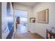 Bright hallway with access to living area and art at 5378 Pendini Point Ct, Las Vegas, NV 89141