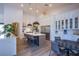 Modern kitchen with island and white shaker cabinets at 5378 Pendini Point Ct, Las Vegas, NV 89141