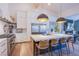 Modern kitchen with white cabinets, a large island, and stainless steel appliances at 5378 Pendini Point Ct, Las Vegas, NV 89141