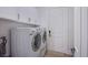 Bright laundry room, washer, dryer, and cabinets at 5378 Pendini Point Ct, Las Vegas, NV 89141