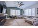 Relaxing living room with sectional sofa and fireplace at 5378 Pendini Point Ct, Las Vegas, NV 89141