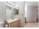 Bathroom with vanity, toilet, and access to other rooms at 6750 Del Rey Ave # 122, Las Vegas, NV 89146