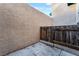 Small private patio with concrete flooring and wooden fence at 6750 Del Rey Ave # 122, Las Vegas, NV 89146