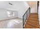 Wooden staircase with black railing in living room at 6750 Del Rey Ave # 122, Las Vegas, NV 89146