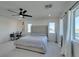 Bright bedroom with queen-size bed, workspace, and ceiling fan at 6942 Alexandrite Peak St, Las Vegas, NV 89148