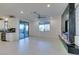 Living room with fireplace, sliding door, and ceiling fan at 6942 Alexandrite Peak St, Las Vegas, NV 89148