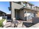 Small patio with seating area located next to the house entrance at 6942 Alexandrite Peak St, Las Vegas, NV 89148