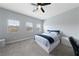 Comfortable bedroom with ceiling fan and large windows at 7544 Nicklin St, Las Vegas, NV 89143