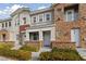 Two-story townhome with stone accents and landscaping at 7544 Nicklin St, Las Vegas, NV 89143