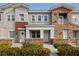 Two-story townhome with stone accents and landscaping at 7544 Nicklin St, Las Vegas, NV 89143