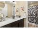 Clean bathroom with a shower/tub combo and modern vanity at 7563 Saguaro Cactus Ave, Las Vegas, NV 89178