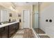 Modern bathroom with double vanity and large walk-in shower at 7563 Saguaro Cactus Ave, Las Vegas, NV 89178