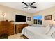 Cozy bedroom with a queen-size bed and ample dresser storage at 7563 Saguaro Cactus Ave, Las Vegas, NV 89178