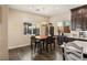 Breakfast nook with a wooden table and chairs, adjacent to kitchen at 7563 Saguaro Cactus Ave, Las Vegas, NV 89178