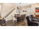 Bright dining area with a large wooden table and seating for eight at 7563 Saguaro Cactus Ave, Las Vegas, NV 89178