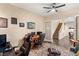 Spacious home office with wood flooring and large windows at 7563 Saguaro Cactus Ave, Las Vegas, NV 89178