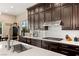 Modern kitchen with stainless steel appliances and white quartz countertops at 7563 Saguaro Cactus Ave, Las Vegas, NV 89178