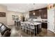 Modern kitchen with dark wood cabinetry and a large island at 7563 Saguaro Cactus Ave, Las Vegas, NV 89178