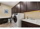 Bright laundry room with washer, dryer and extra counter space at 7563 Saguaro Cactus Ave, Las Vegas, NV 89178