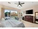 Main bedroom with sliding glass doors opening to a pool view at 7563 Saguaro Cactus Ave, Las Vegas, NV 89178