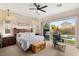 Main bedroom with sliding glass doors leading to a private backyard oasis at 7563 Saguaro Cactus Ave, Las Vegas, NV 89178