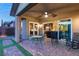 Patio with seating area and view into the kitchen and living room at 7563 Saguaro Cactus Ave, Las Vegas, NV 89178