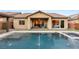 Inviting swimming pool with spa and water features at 7563 Saguaro Cactus Ave, Las Vegas, NV 89178